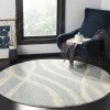 Tapete Adira Brochas Onduladas en Marfil con Gris