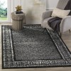 Tapete Adira de Diamantes en Negro con Gris