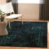 Tapete Adira de Hojas en Negro con Verde Azulado