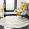 Tapete Adira Brochas Onduladas en Gris con Crema