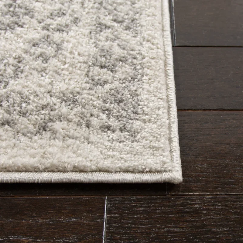 Tapete Adira Vintage Pátina en Marfil con Gris