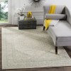 Tapete Adira Vintage Pátina en Marfil con Gris