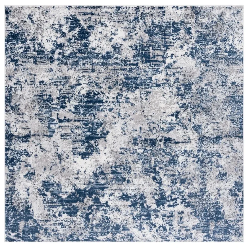 Tapete Emilia Abstracto en Marfil con Azul