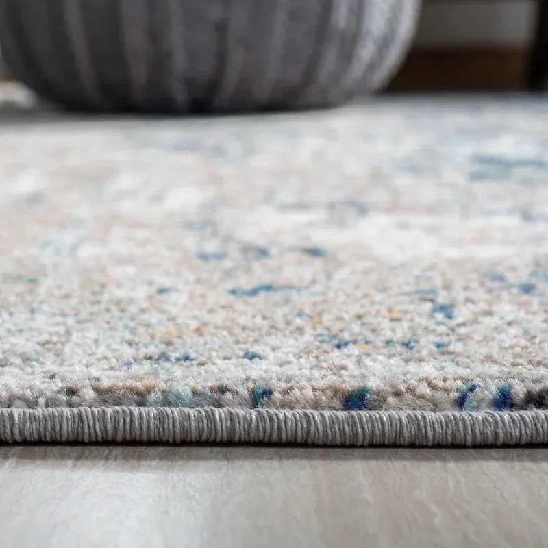 Tapete James de Textura Moteada en Gris con Azul