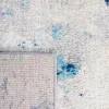 Tapete Jaspis Abstracto en Marfil con Azul en sala