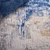 Tapete Palmar de Líneas Ondulantes en Beige con Azul