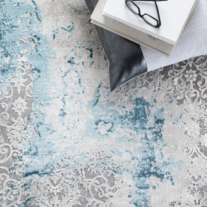Tapete Prado de Brochazos Desgastado en Gris con Azul