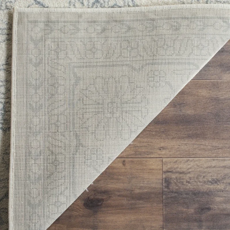 Tapete Adira Vintage Pátina en Marfil con Gris