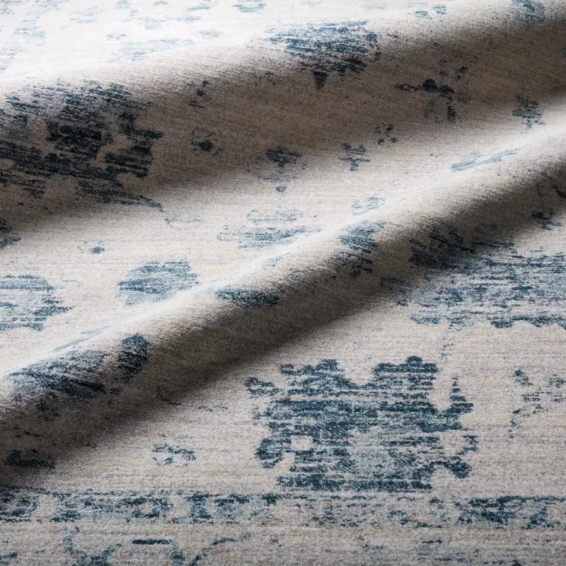 Tapete Dalia Floral Desgastado en Azul y Gris