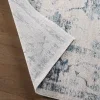 Tapete Dalia Floral Desgastado en Azul y Gris