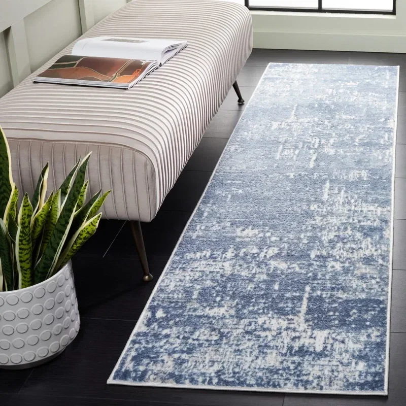 Tapete Emilia Abstracto Texturizado en Marfil con Azul