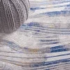 Tapete Palmar de Ondas Fluidas en Beige con Azul