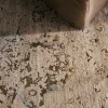 Tapete Susurro Ikat Vintage en Gris