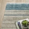 Tapete Bruma Bloques en Azul sobre el piso