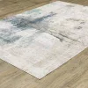 Tapete Cava Abstracto en Marfil con Azul Petróleo sobre el piso