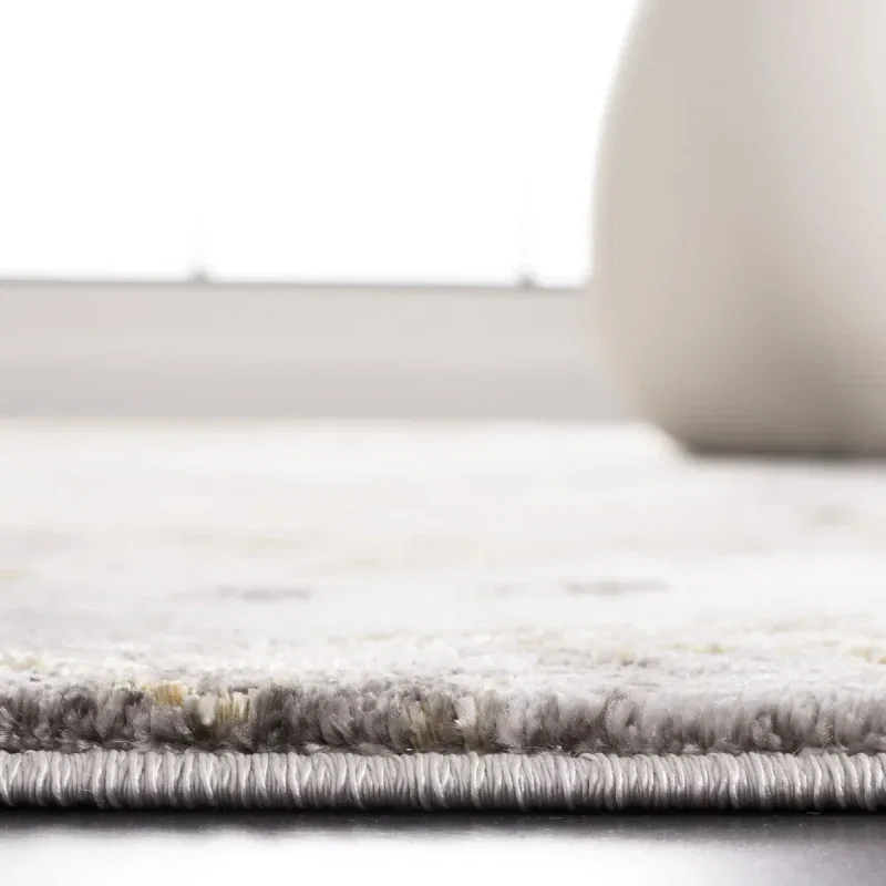 Tapete Destreza de Volutas Distressed en Gris con Dorado