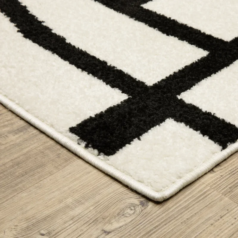 Tapete Reyna Deco en Marfil con Negro, detalle de la textura