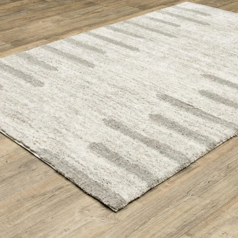 Tapete Veneto Trazos en Marfil con Gris sobre el piso