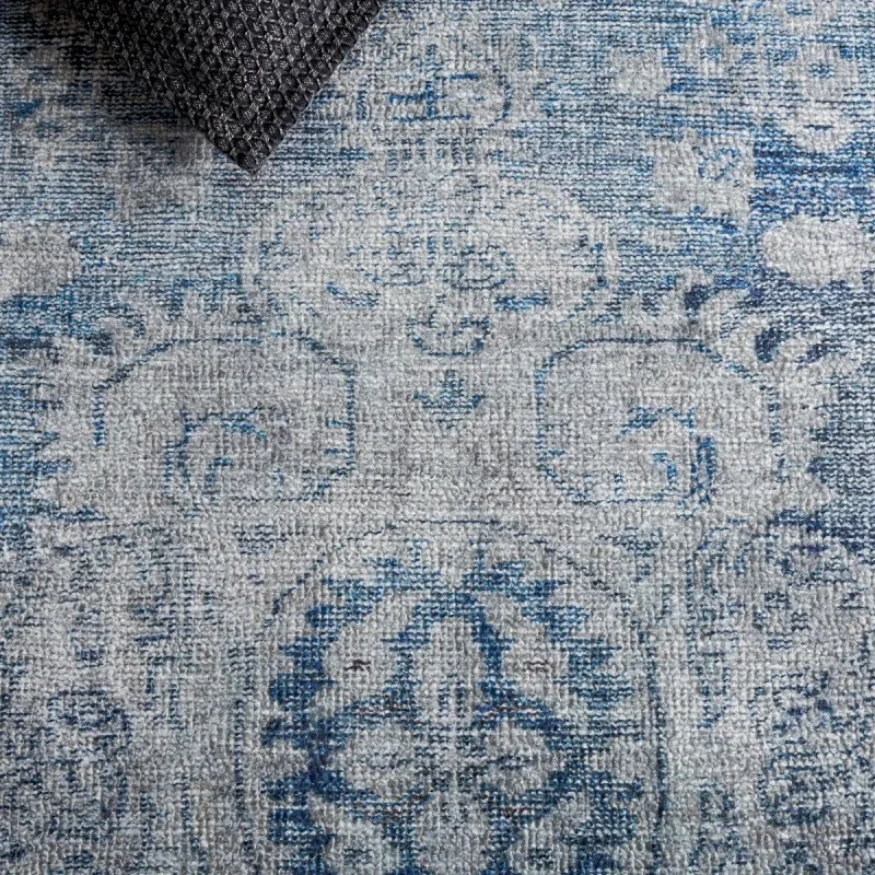 Tapete Pátina Medallón Circular en Azul con Gris