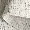 Tapete Puerto Moteado en Marfil con Gris Carbón